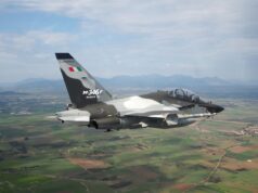 Indonesia signs for 12 M-346 F light fighters from Leonardo Military jet in flight, Italian M-346F trainer with flag on tail against a rural valley and mountains far below.