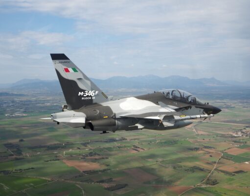 Indonesia signs for 12 M-346 F light fighters from Leonardo Military jet in flight, Italian M-346F trainer with flag on tail against a rural valley and mountains far below.