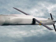 Raytheon pitches Red Kite weapon at RAF stockpile gap Unmanned aerial vehicle (drone) in flight against a cloudy sky with a gray fuselage and two large propellers.