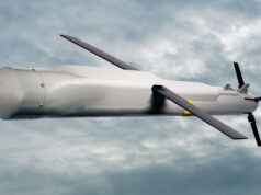 Raytheon pitches Red Kite weapon at RAF stockpile gap Unmanned aerial vehicle (drone) in flight against a cloudy sky with a gray fuselage and two large propellers.