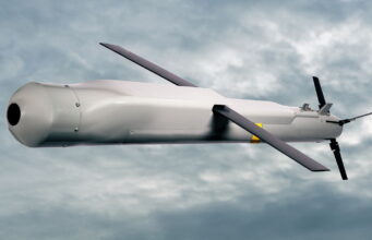 Raytheon pitches Red Kite weapon at RAF stockpile gap Unmanned aerial vehicle (drone) in flight against a cloudy sky with a gray fuselage and two large propellers.