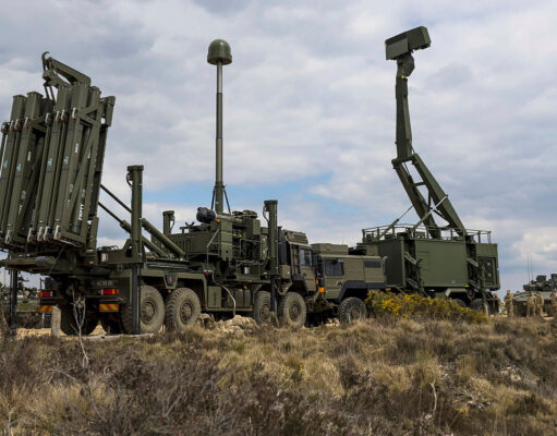 Sky Sabre doubling on track with deliveries from late 2026 Military mobile missile system on a truck with multiple vertical launch tubes, in a dry open area under a cloudy sky.