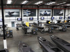 Kraken hits £1bn valuation after funding round Industrial boat factory with row of speedboats on workbenches and tools along the wall
