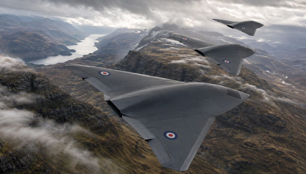 CCAstormfighterconcept Three RAF flying-wing aircraft in formation above a winding fjord and rugged mountains in the distance.