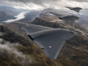 Storm Fighter drones to provide UK air and missile defence Three RAF flying-wing aircraft in formation above a winding fjord and rugged mountains in the distance.