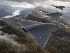 Storm Fighter drones to provide UK air and missile defence Three RAF flying-wing aircraft in formation above a winding fjord and rugged mountains in the distance.