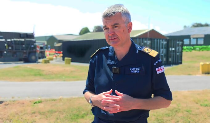 From Thursday War to rewind button – how FOST is changing Man in a dark blue uniform stands outdoors, hands clasped, with a facility and equipment behind him.