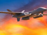 Stealth strike missile heading for MQ-9B drone family Unmanned military drone in flight with an orange sunset sky behind it.