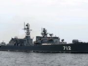 Russian warship opens fire near English coast Gray military destroyer with hull number 712 sailing on calm sea, multiple antennas and weapons on deck