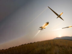 BAE unveils BlackThorn warhead for drones and missiles Three gliders soaring in a dusky sky with light-trail contrails behind them.