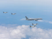 Excalibur flying testbed enters new GCAP trials phase Six gray military fighter jets flying in formation over a blue sky with white clouds.