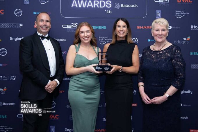 Babcock takes two wins at Enginuity Skills Awards 2026 Four people in formal wear posing with a trophy at an awards ceremony backdrop.