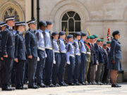 Cadet expansion target slips five years to 2035 Line of uniformed military personnel standing at attention during a ceremonial parade outside a historic building.