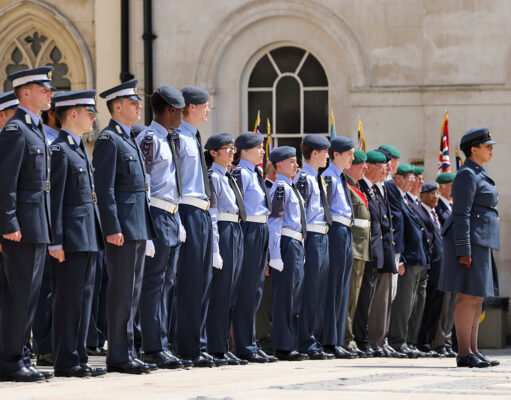 Cadet expansion target slips five years to 2035 Line of uniformed military personnel standing at attention during a ceremonial parade outside a historic building.