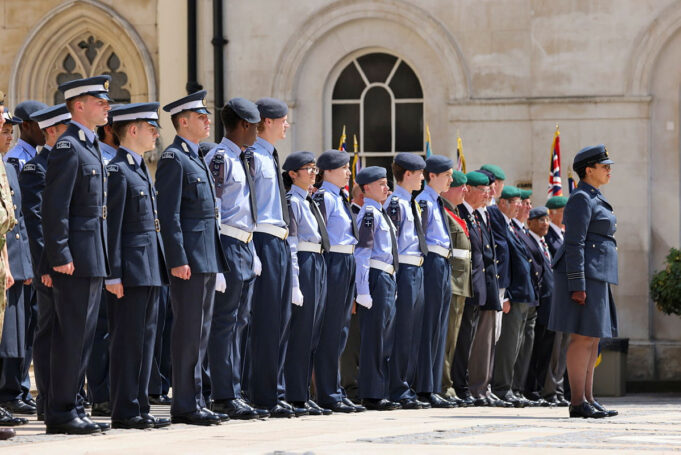 Cadet expansion target slips five years to 2035 Line of uniformed military personnel standing at attention during a ceremonial parade outside a historic building.