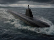 Huge contract awarded to fund new UK nuclear missile subs Dark submarine surfacing and cutting through rough sea under a stormy, low-hanging sky, with a raised sail and antennas visible atop the hull.