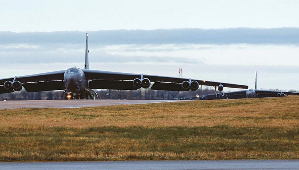 fairford1 B-52 bomber taxiing on a runway at an airfield, engines visible under its long wings.
