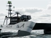 Babcock signs deal to explore armed drone boats Autonomous research vessel at sea with a tall mast and sensor arrays on deck.