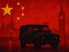 Dark off-road vehicle in a red-tinted London skyline with a large Chinese flag and stars overhead.