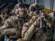 British forces board German warship by air and sea