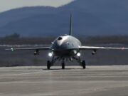 American F-22 stealth jet controls combat drone