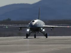 American F-22 stealth jet controls combat drone